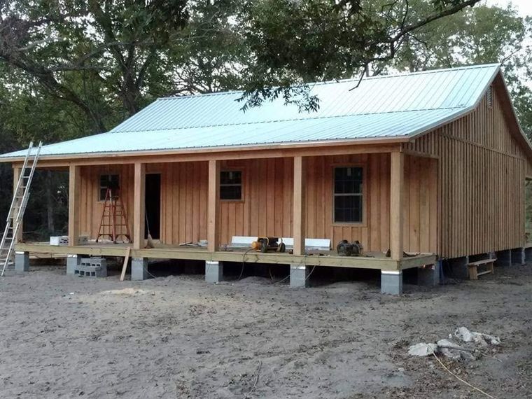 Board-and-batten cabin with a standing-seam metal roof