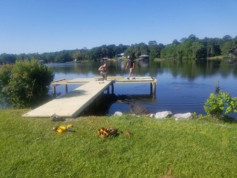 Dock being built out over a lake