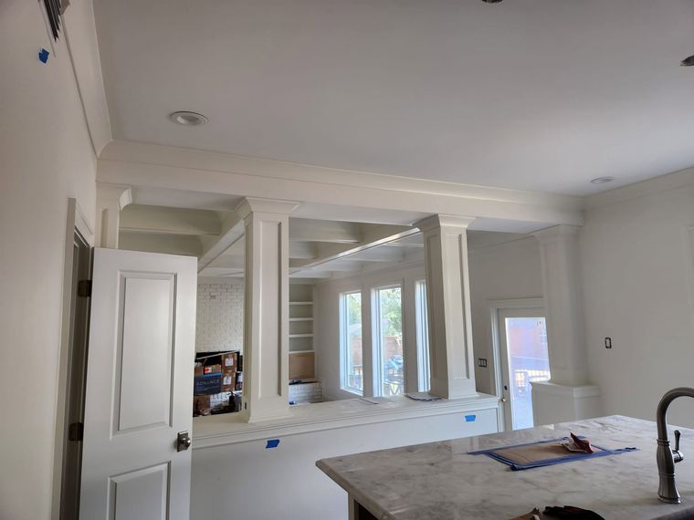 Kitchen with custom cabinetry and trim